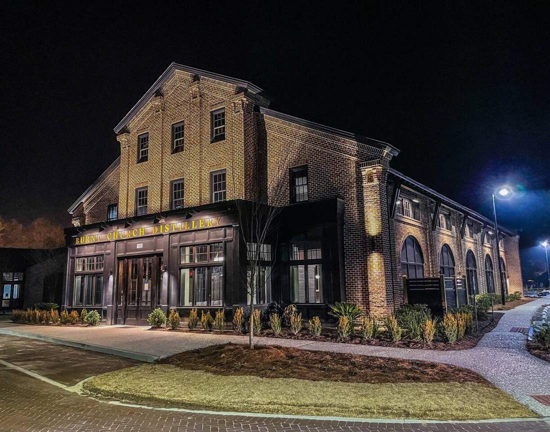 Burnt Church Distillery in Bluffton lit up at night
